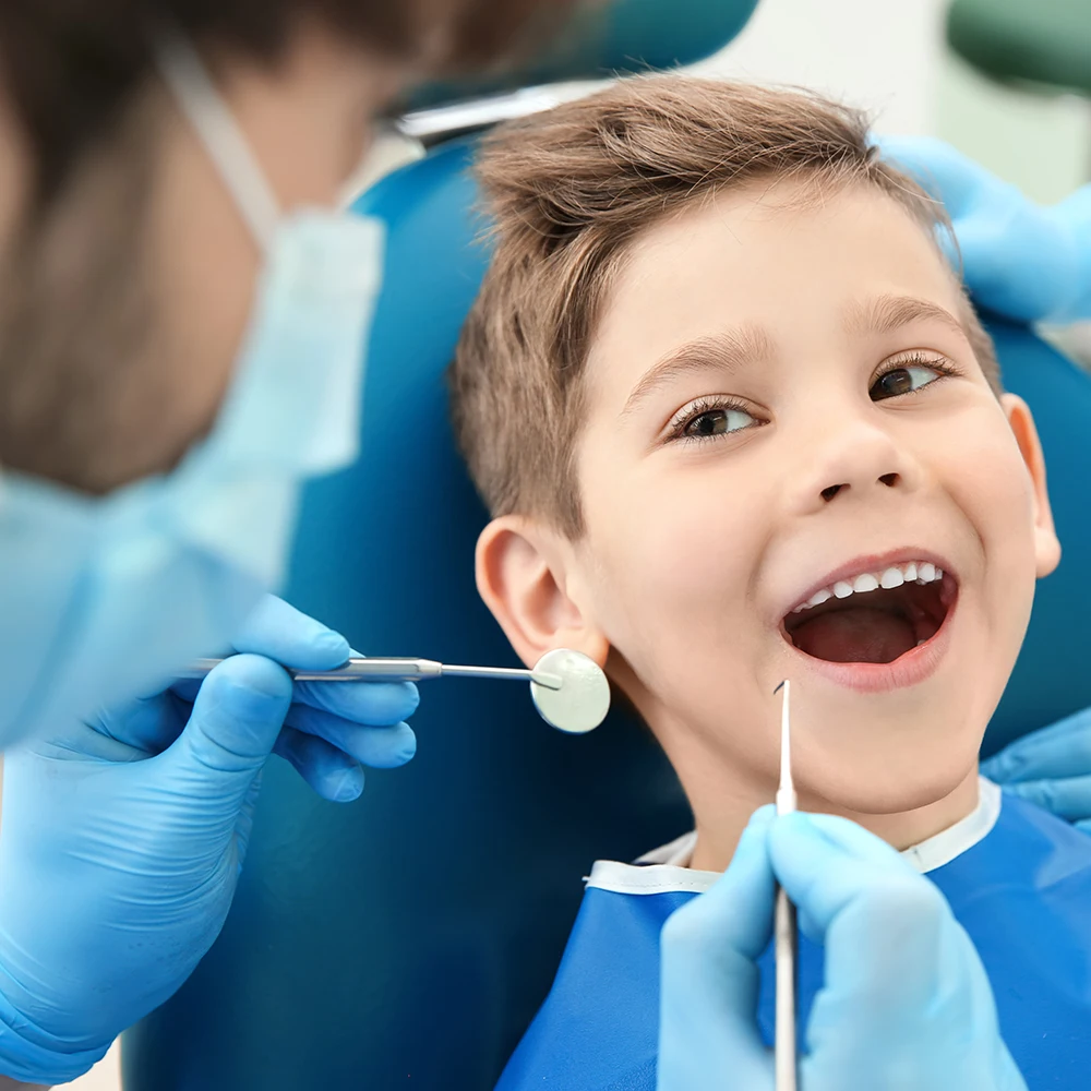 Dentist comforting a child